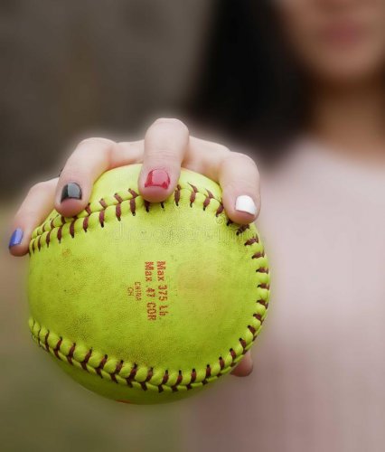 young-lady-pitcher-holds-yellow-softball-seam-grip-manicures-to-boot-lets-play-ball-142016222.jpg